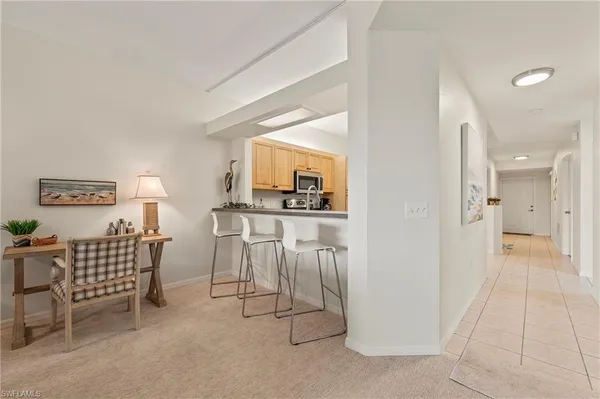 a view of a livingroom with furniture and a flat screen tv