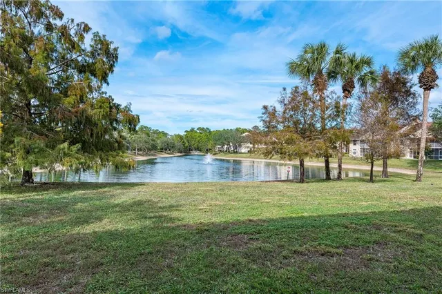 a view of a lake with a yard