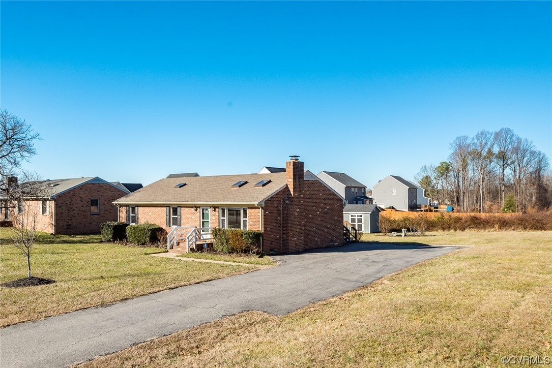 7807 Drexelbrook Road Chesterfield, VA 23832 - Photo 3 of 37 a front view of a house with a yard