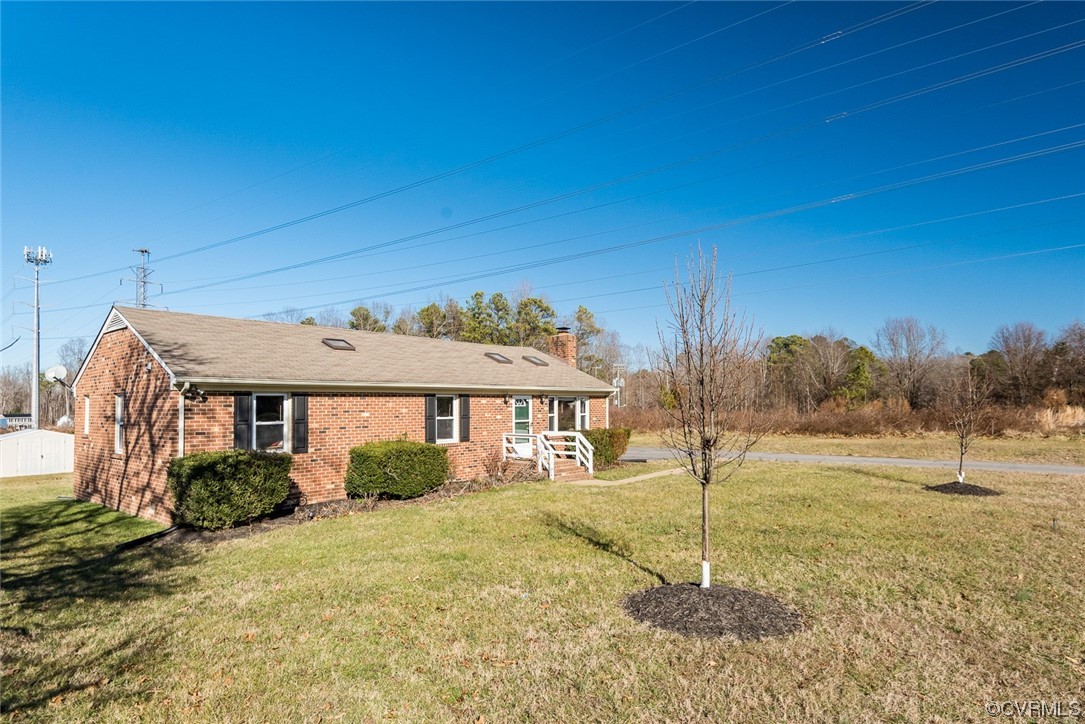 7807 Drexelbrook Road Chesterfield, VA 23832 - Photo 5 of 37 a front view of a house with a yard