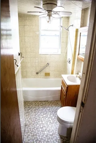 a bathroom with a toilet a sink and a bathtub