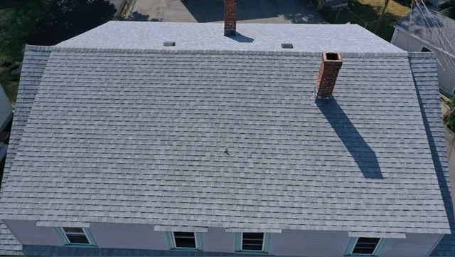 a view of barbeque area with brick walls