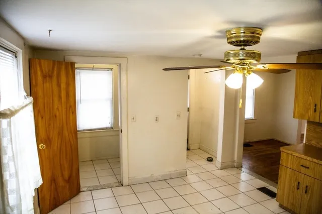 a view of a hallway to closet and wooden floor