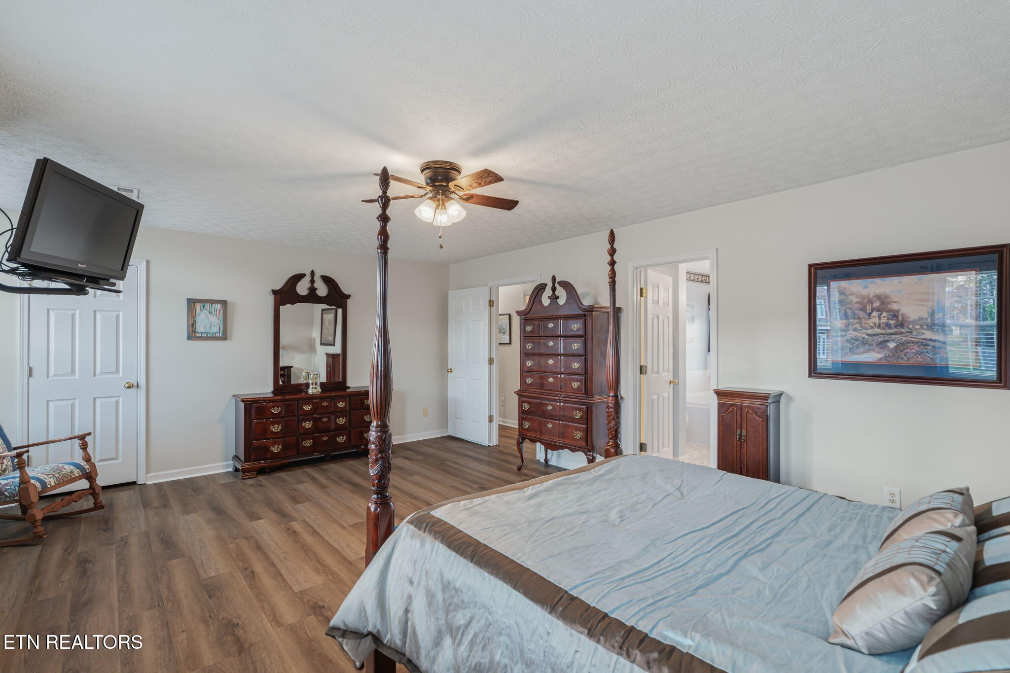 7030 Westerly Winds Road Knoxville, TN 37931 - Photo 24 of 40 a bedroom with furniture and a flat screen tv