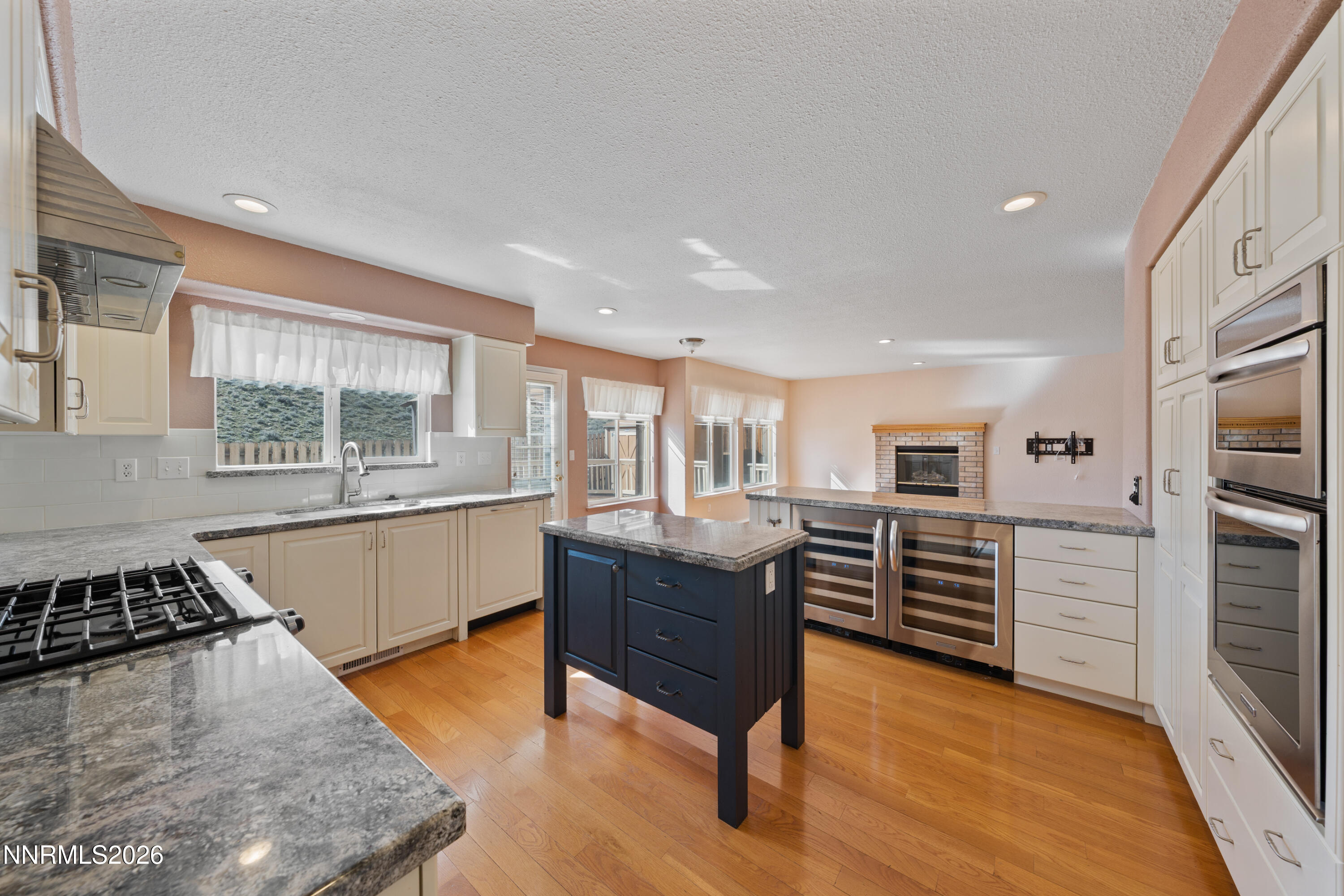 5524 Tappan Drive Reno, NV 89523 - Photo 14 of 70 a kitchen with stainless steel appliances granite countertop a stove and a refrigerator