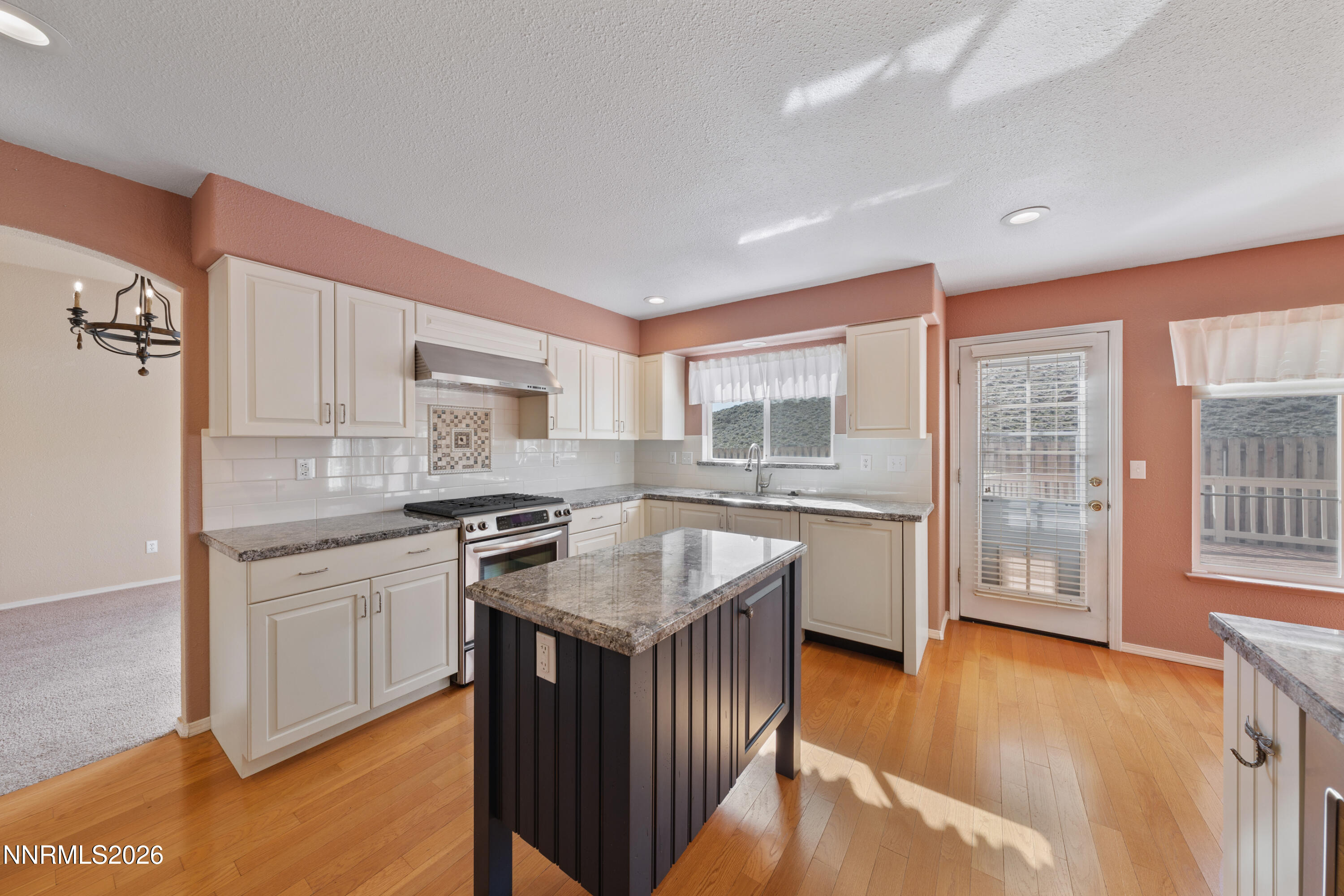 5524 Tappan Drive Reno, NV 89523 - Photo 15 of 70 a kitchen with stainless steel appliances granite countertop a stove a sink and a refrigerator
