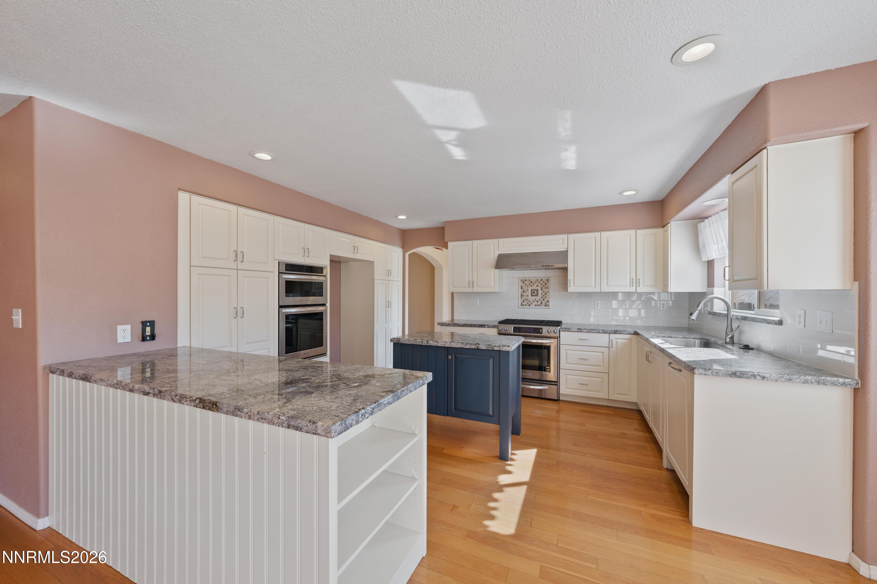 5524 Tappan Drive Reno, NV 89523 - Photo 16 of 70 a kitchen with stainless steel appliances granite countertop a sink stove and refrigerator