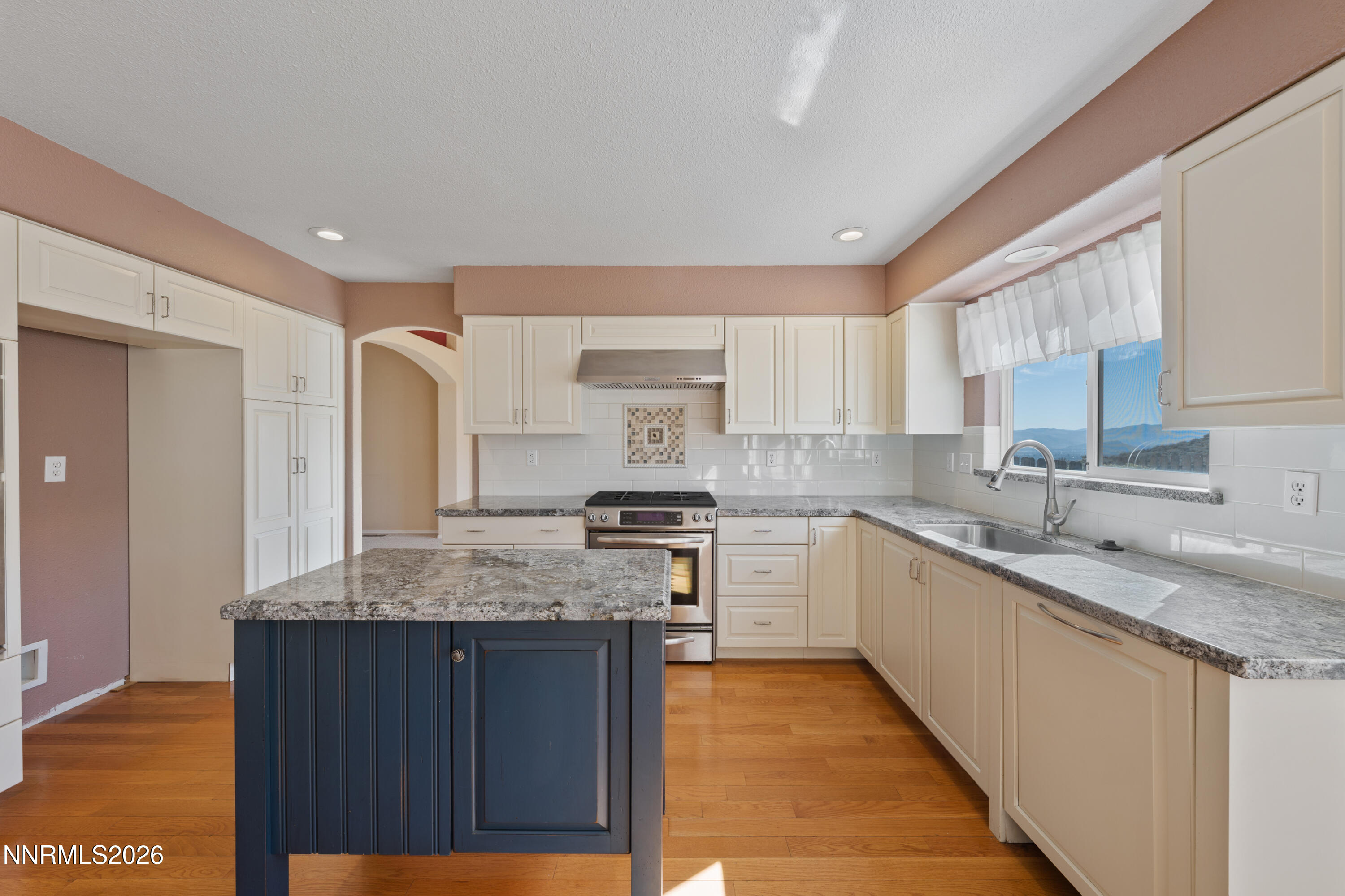 5524 Tappan Drive Reno, NV 89523 - Photo 18 of 70 a kitchen with granite countertop cabinets stainless steel appliances a sink and a counter top space