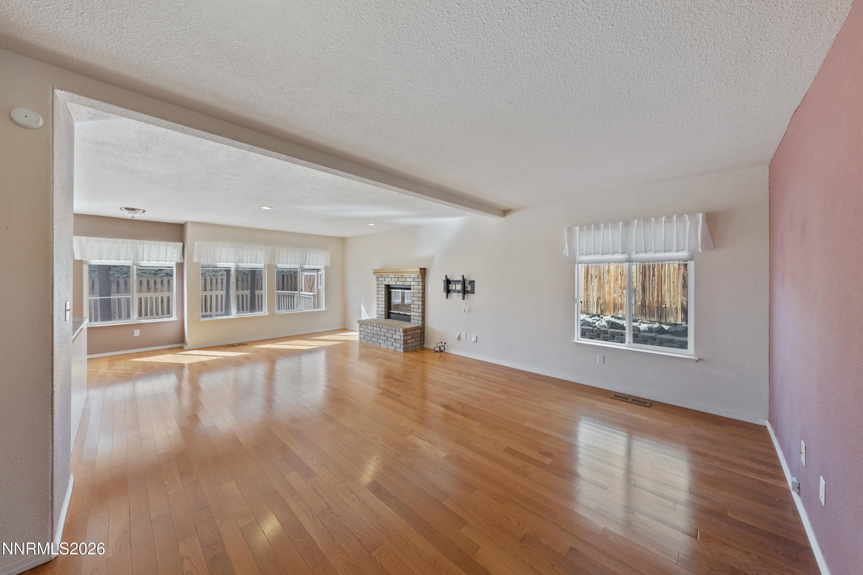 5524 Tappan Drive Reno, NV 89523 - Photo 23 of 70 a view of an empty room with window and wooden floor