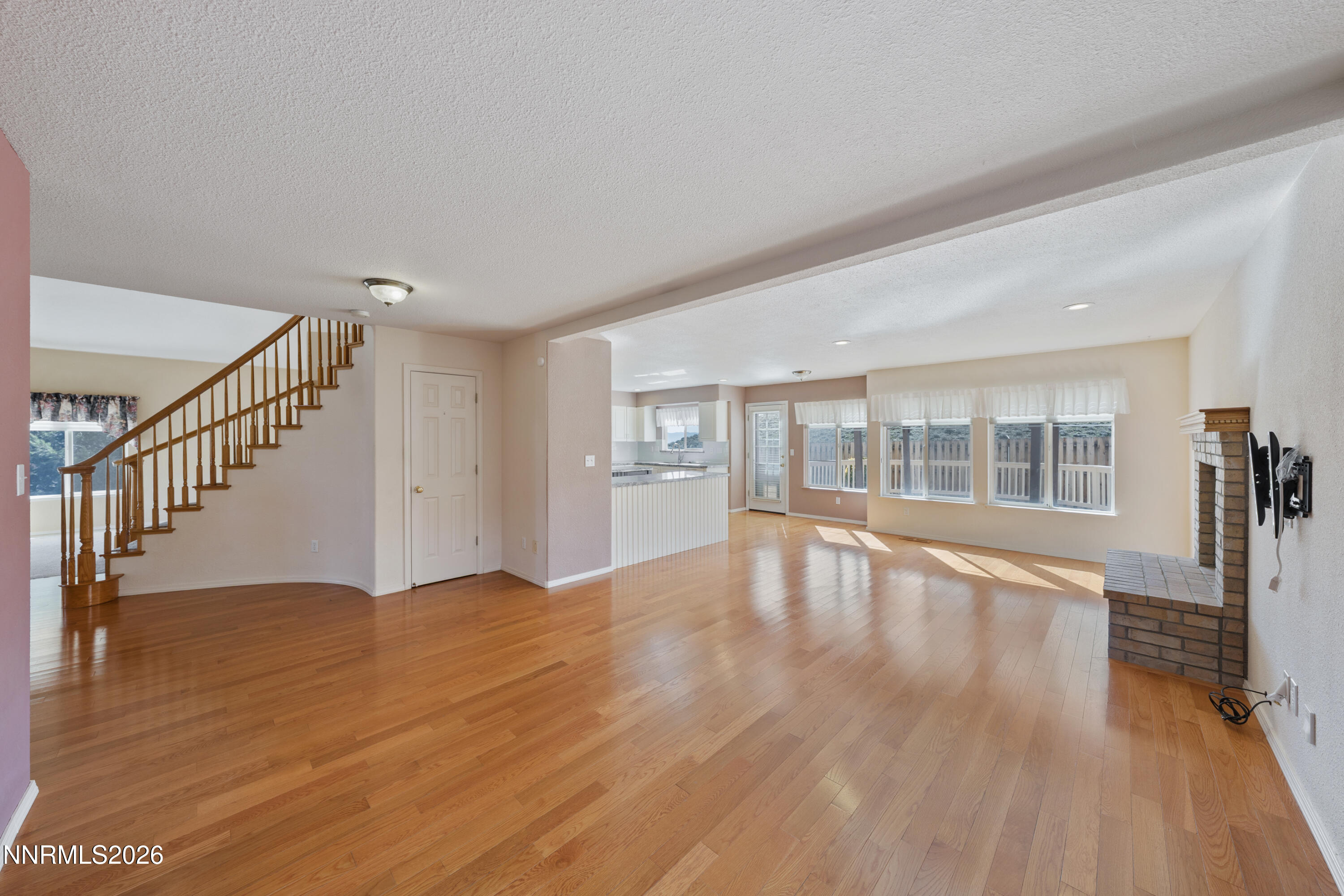 5524 Tappan Drive Reno, NV 89523 - Photo 24 of 70 a view of an empty room with wooden floor and a window