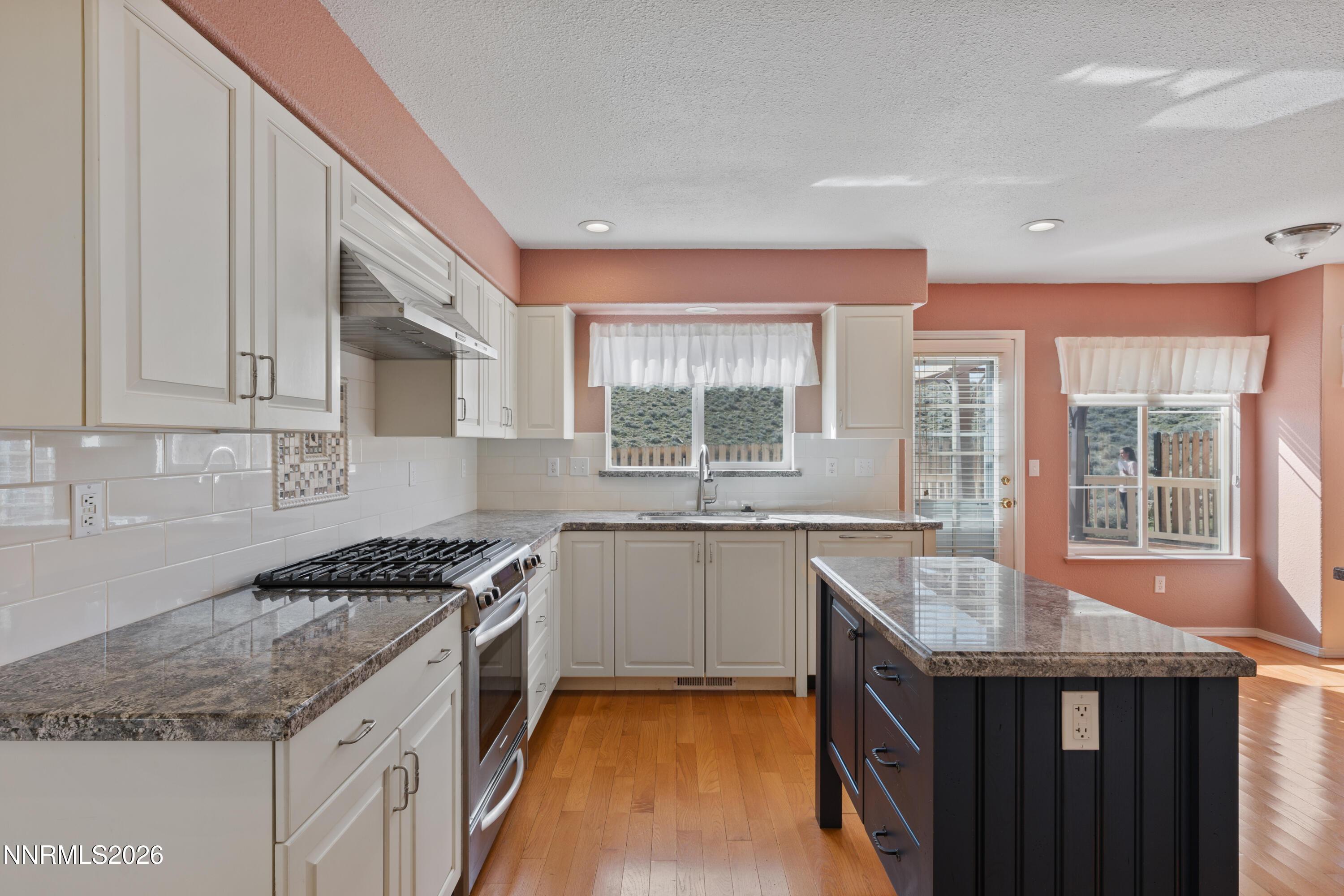 5524 Tappan Drive Reno, NV 89523 - Photo 3 of 70 a kitchen with granite countertop a sink stove and cabinets