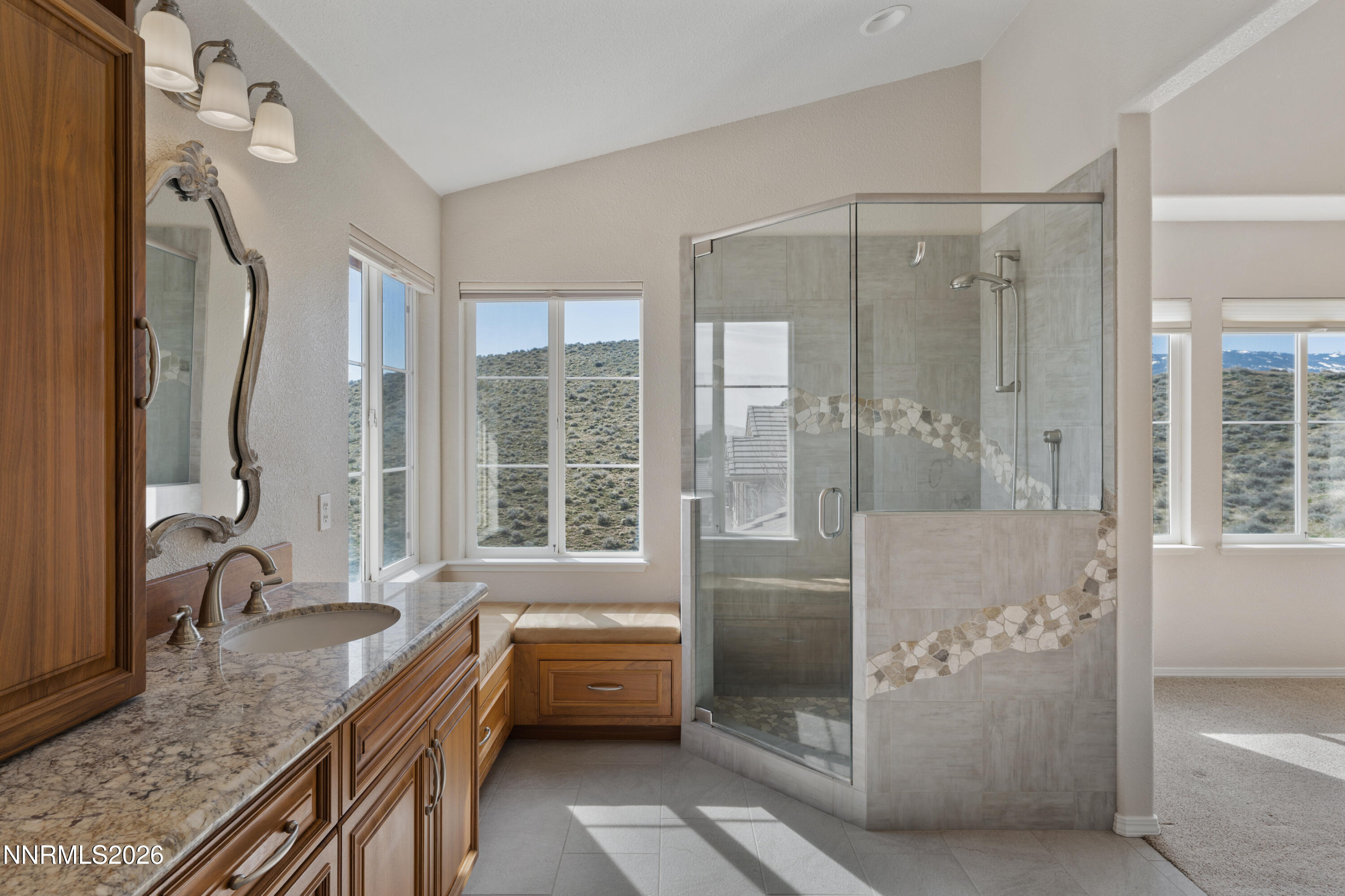 5524 Tappan Drive Reno, NV 89523 - Photo 35 of 70 a bathroom with a granite countertop sink a mirror and a bathtub