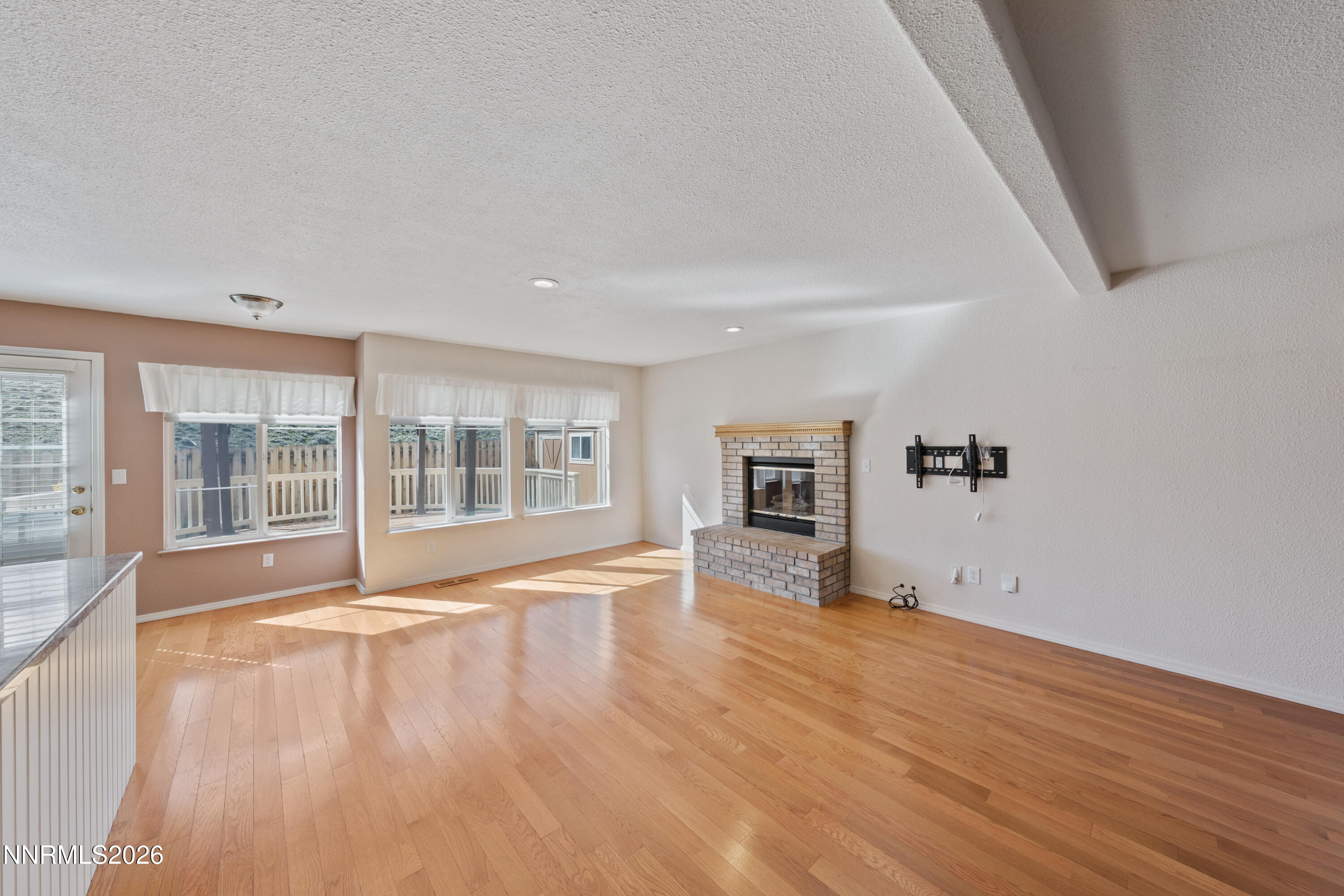 5524 Tappan Drive Reno, NV 89523 - Photo 4 of 70 a view of empty room with wooden floor and fan