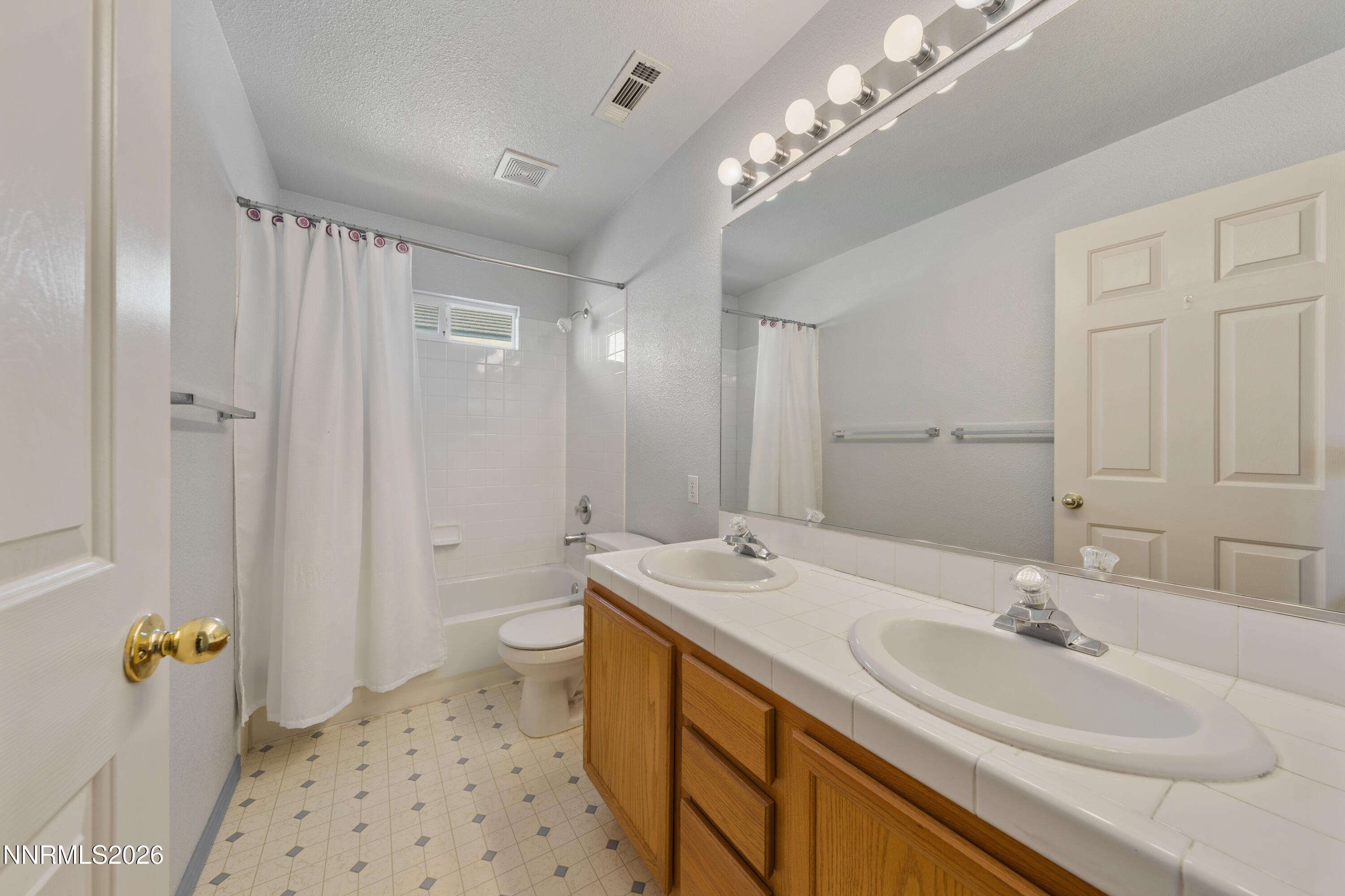 5524 Tappan Drive Reno, NV 89523 - Photo 41 of 70 a bathroom with a sink a toilet and shower