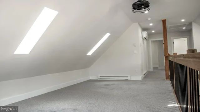 en empty room with a kitchen and a sink