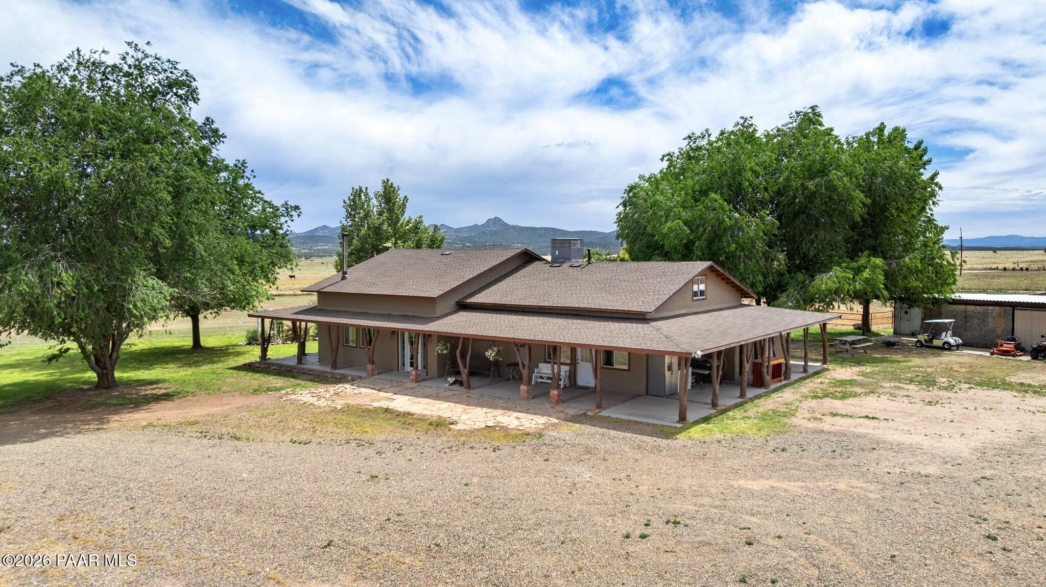3900 West Runway Road Paulden, AZ 86334 - Photo 2 of 25 a aerial view of a house with swimming pool and big yard