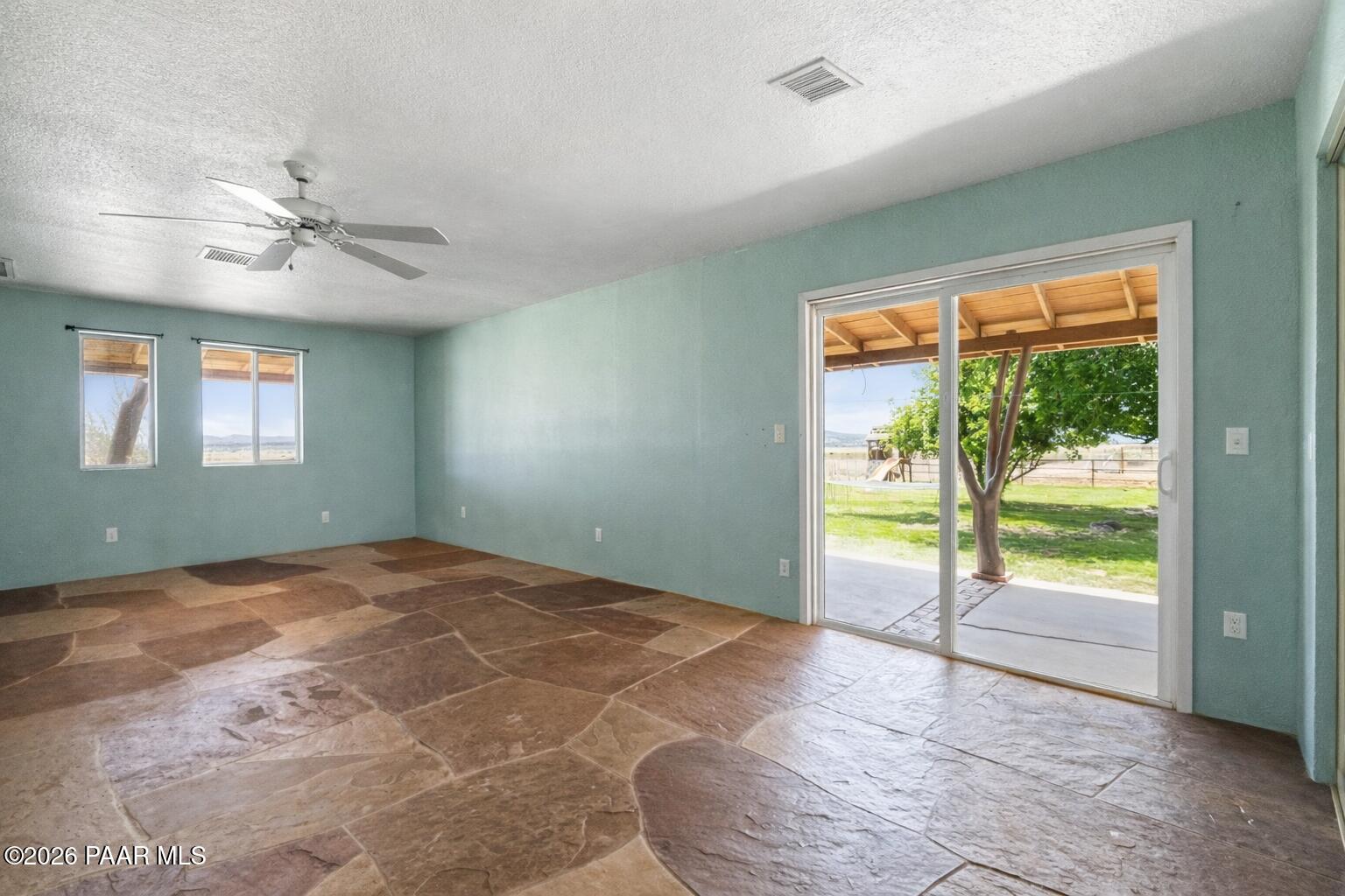 3900 West Runway Road Paulden, AZ 86334 - Photo 5 of 25 wooden floor in an empty room with a window