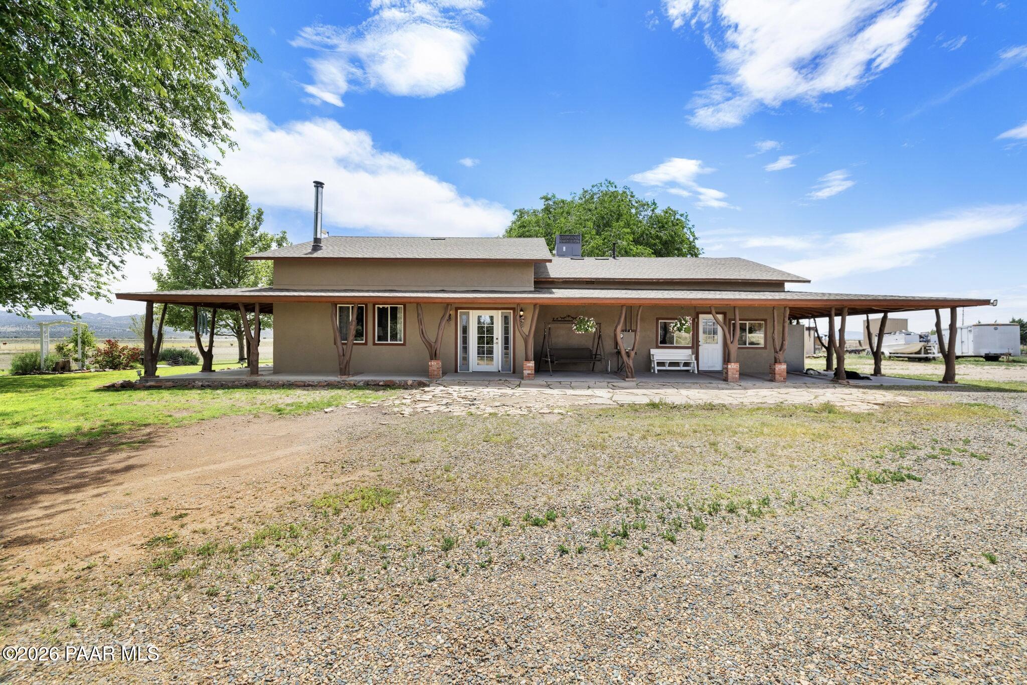3900 West Runway Road Paulden, AZ 86334 - Photo 6 of 25 a front view of a house with a yard