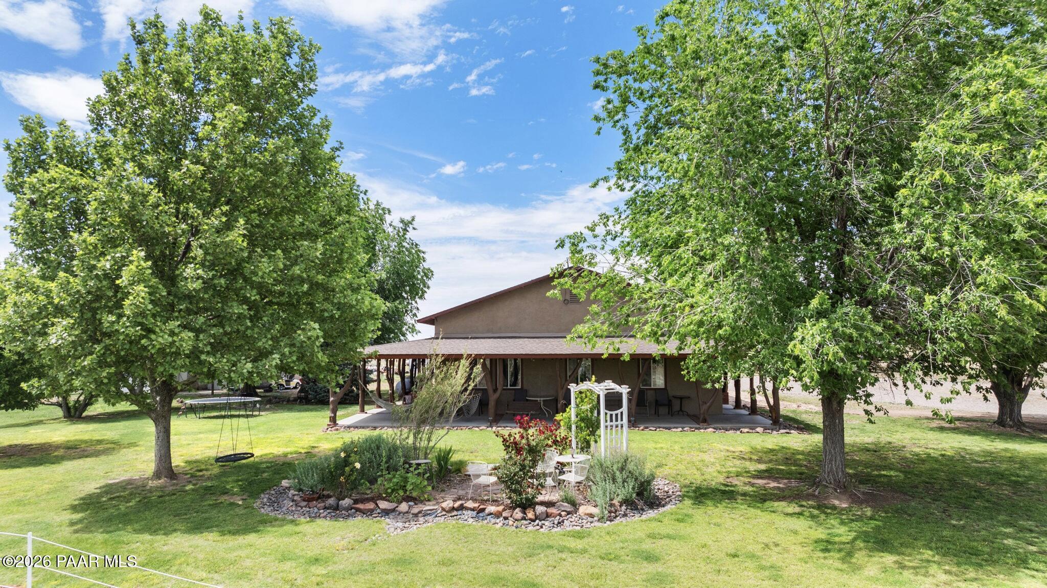 3900 West Runway Road Paulden, AZ 86334 - Photo 8 of 25 a front view of a house with garden