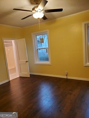 697 Grenada Terrace Macon, GA 31206 - Photo 11 of 18 a view of an empty room with wooden floor and a ceiling fan