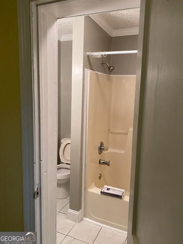 697 Grenada Terrace Macon, GA 31206 - Photo 12 of 18 a bathroom with a granite countertop shower