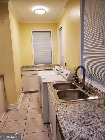 697 Grenada Terrace Macon, GA 31206 - Photo 14 of 18 a kitchen with a sink and a stove top oven