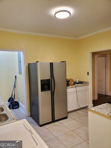 697 Grenada Terrace Macon, GA 31206 - Photo 16 of 18 a kitchen with a refrigerator sink and cabinets