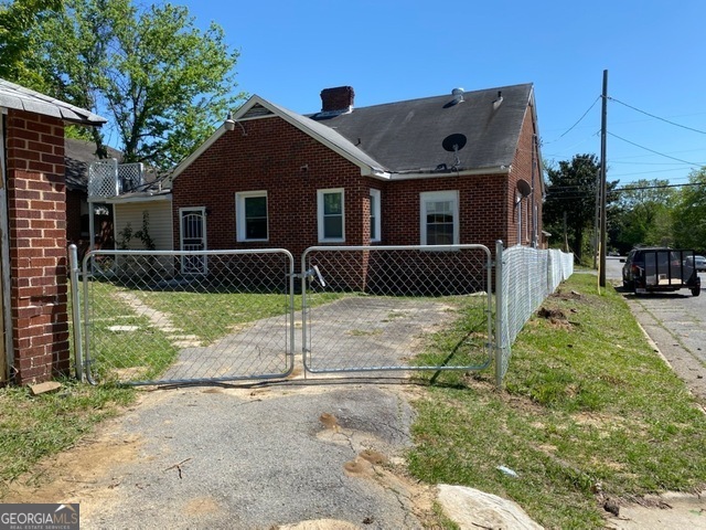697 Grenada Terrace Macon, GA 31206 - Photo 17 of 18 a front view of a house with a yard