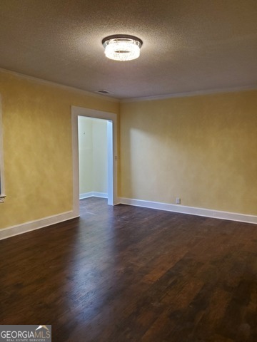 697 Grenada Terrace Macon, GA 31206 - Photo 4 of 18 a view of an empty room with wooden floor