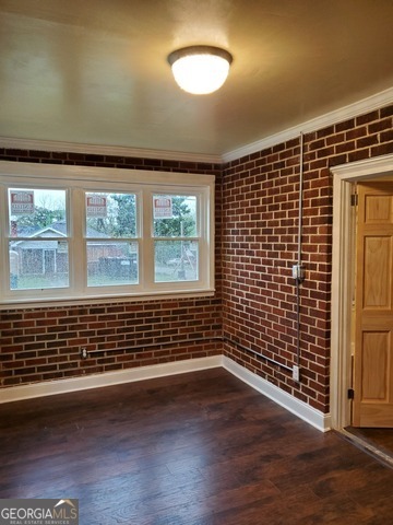 697 Grenada Terrace Macon, GA 31206 - Photo 6 of 18 an empty room with wooden floor and windows