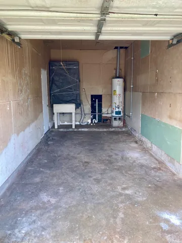 a view of empty room with stairs and fireplace