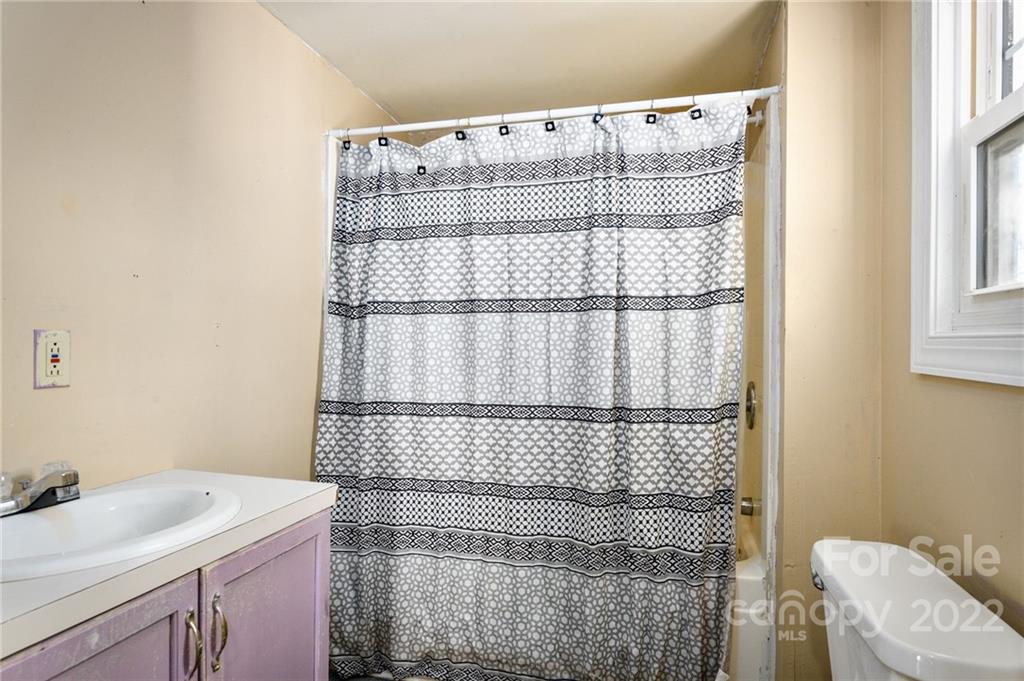 240 Duke Street Cooleemee, NC 27014 - Photo 14 of 18 a bathroom with a sink and a shower