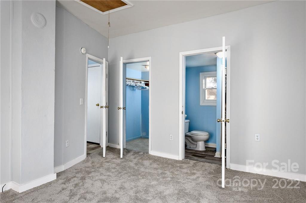 240 Duke Street Cooleemee, NC 27014 - Photo 9 of 18 a view of a room with walk in closet and bathroom