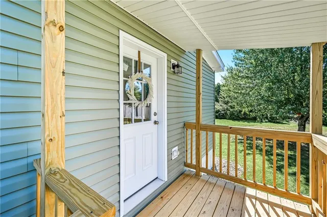 a view of a balcony with furniture