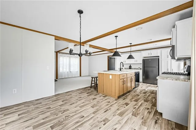 a view of a kitchen with a sink and dishwasher