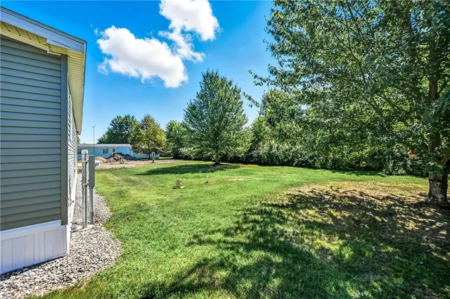 a view of a yard with an outdoor space