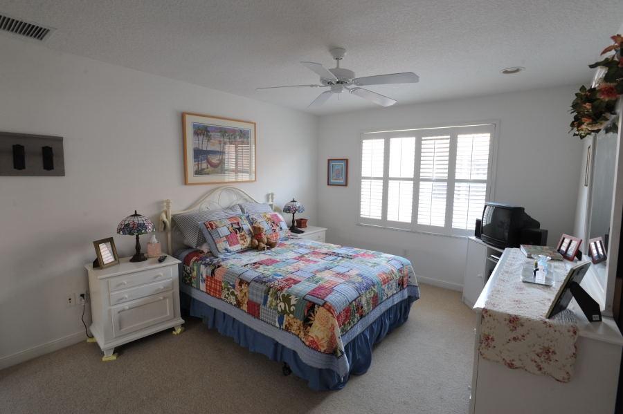 4804 South Classical Boulevard Delray Beach, FL 33445 - Photo 16 of 31 a bedroom with a bed and a window