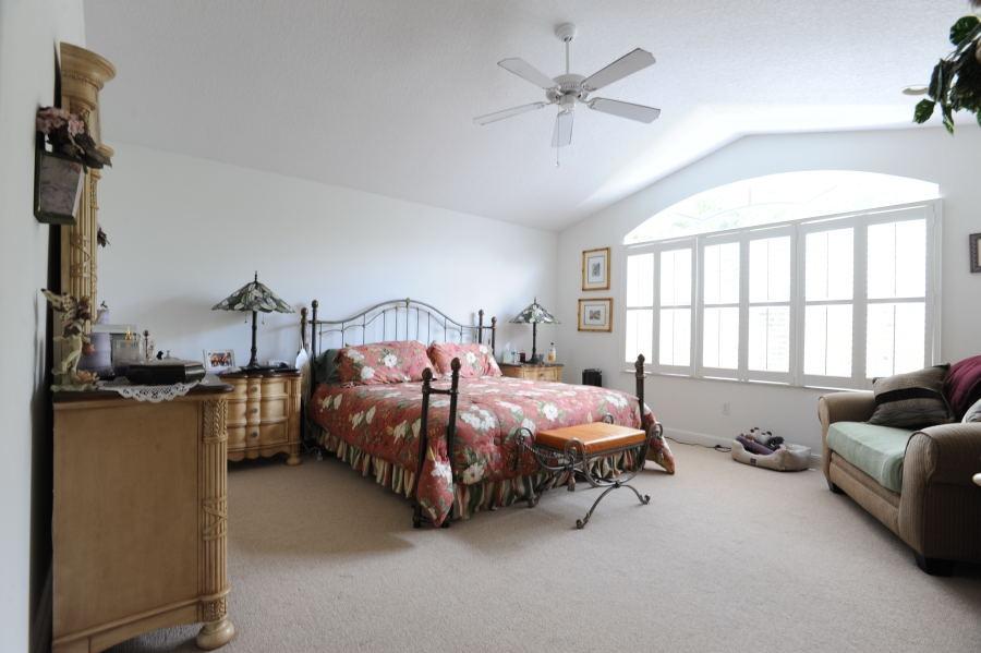 4804 South Classical Boulevard Delray Beach, FL 33445 - Photo 18 of 31 a bedroom with bed and window