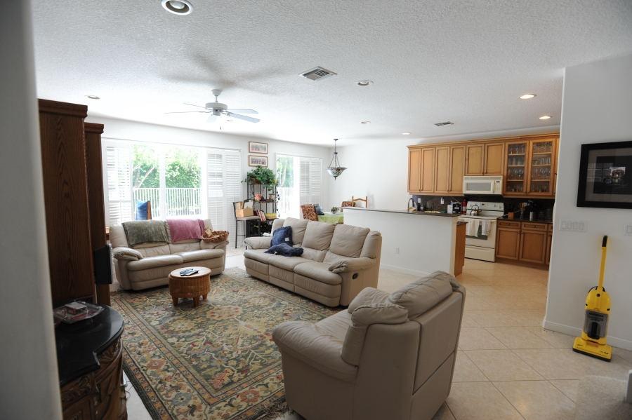 4804 South Classical Boulevard Delray Beach, FL 33445 - Photo 6 of 31 a living room with furniture and a flat screen tv