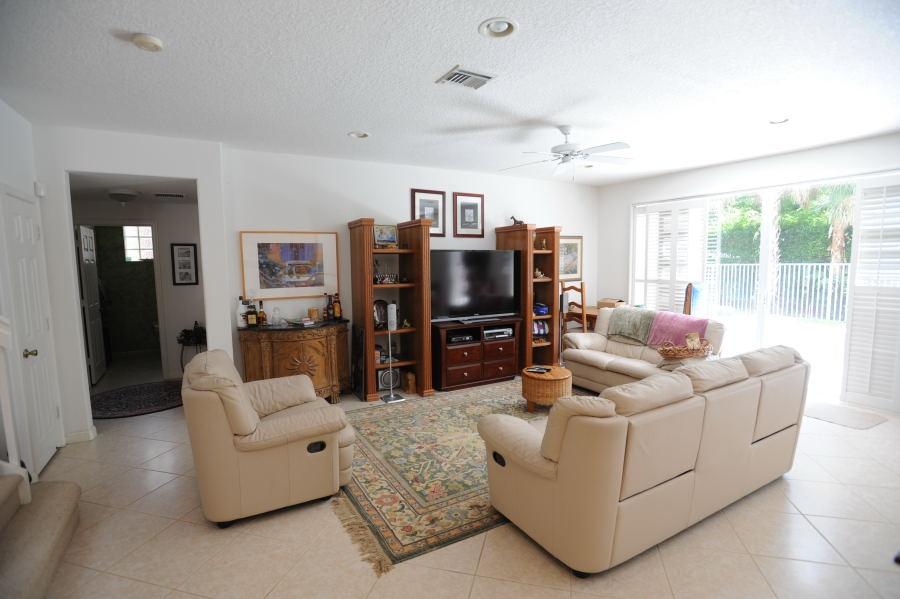 4804 South Classical Boulevard Delray Beach, FL 33445 - Photo 8 of 31 a living room with furniture and a flat screen tv