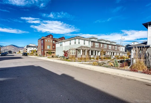 a view of multiple houses with a street