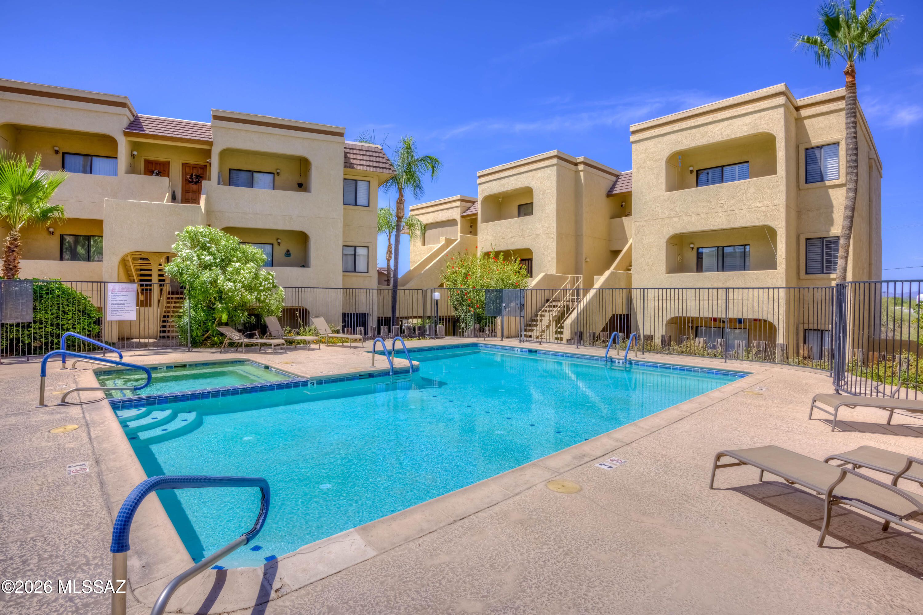 5500 North Valley View Road, Unit 123 Tucson, AZ 85718 - Photo 36 of 36 a view of a house with swimming pool and sitting area
