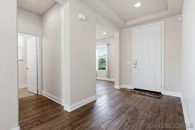 a view of entryway with wooden floor
