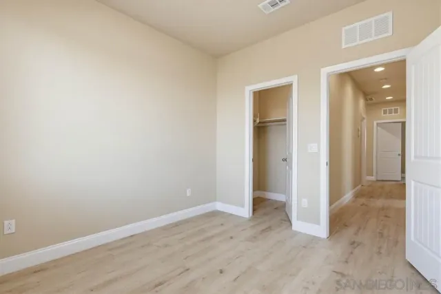 a view of a patio with a table and chairs