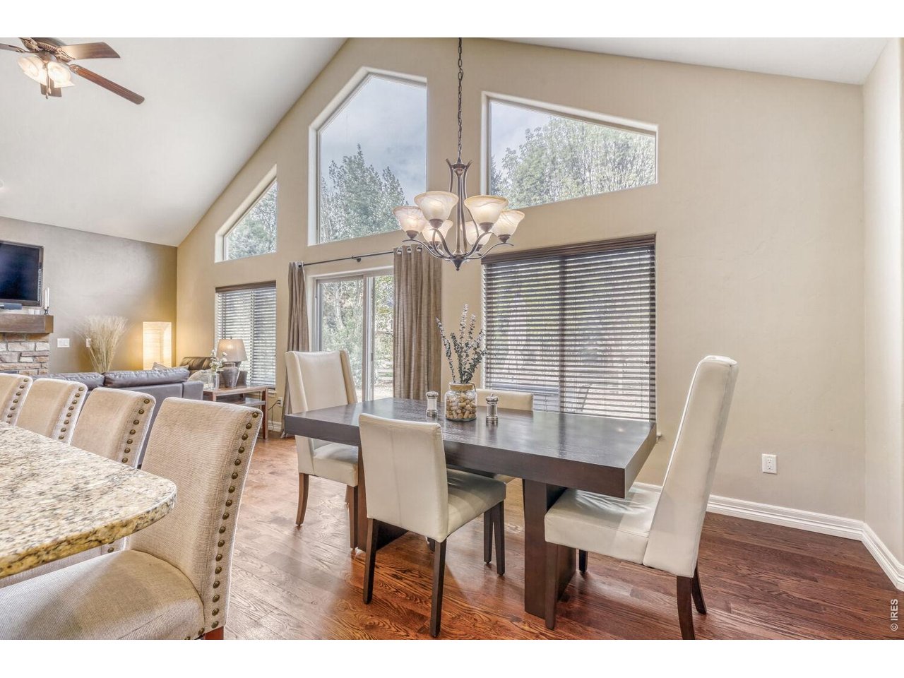 7992 St Street Frederick, CO 80530 - Photo 6 of 28 a view of a dining room with furniture and chandelier