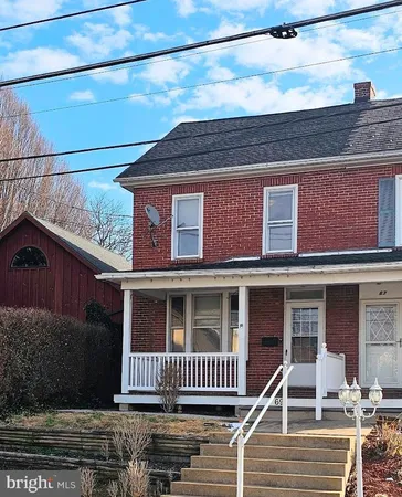 a front view of a house with a porch