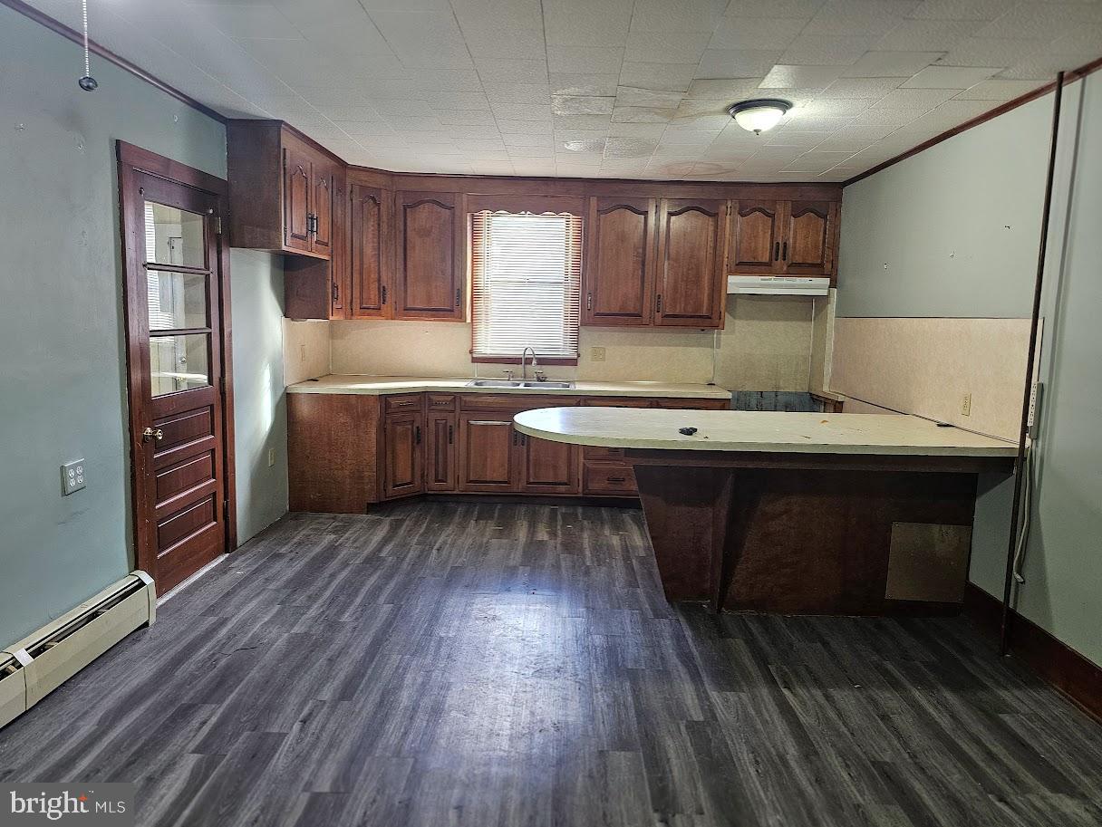 69 North Water Street Lititz, PA 17543 - Photo 6 of 14 Spacious kitchen with rich wooden cabinetry.