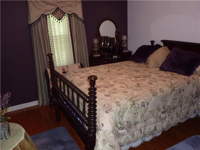 7781 Mill Road Cross Plains, TN 37049 - Photo 8 of 20 a bedroom with bed and a mirror