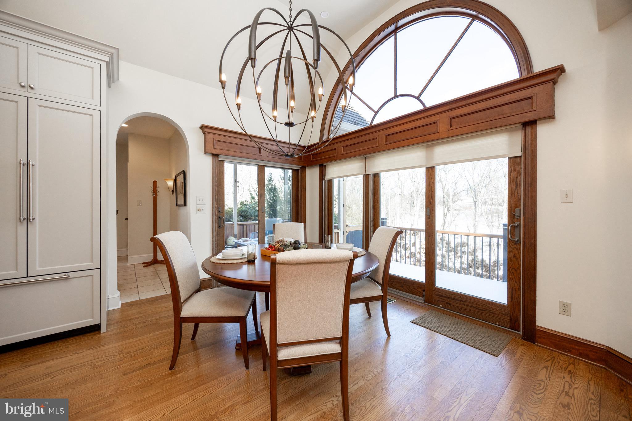 2220 Bodine Road Malvern, PA 19355 - Photo 24 of 86 a dining room with furniture a chandelier and wooden floor