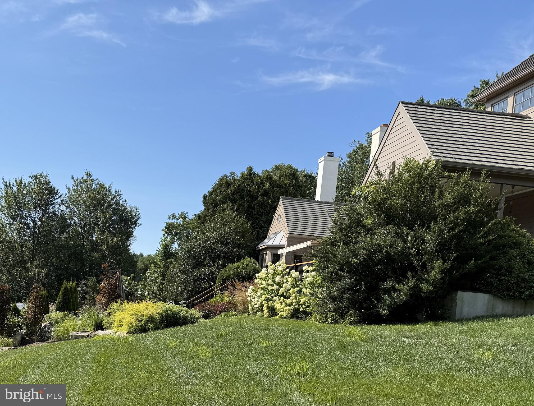 2220 Bodine Road Malvern, PA 19355 - Photo 6 of 86 a view of a house with a yard and a garden
